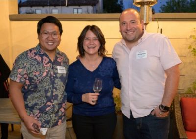 Three people smiling for the camera