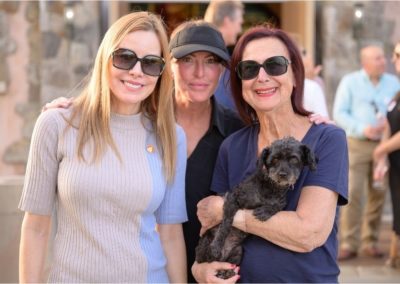 Three ladies and a dog