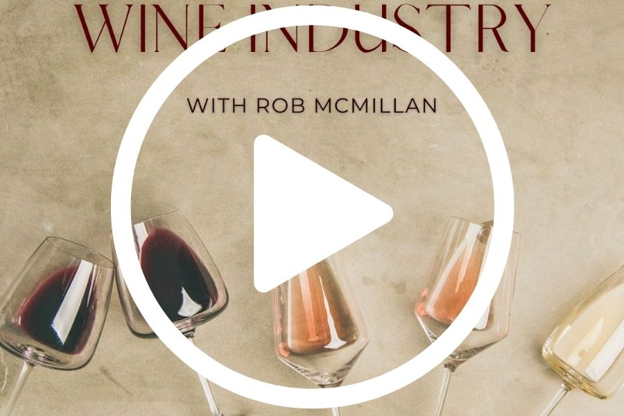 Play button over brown background with three wine glasses