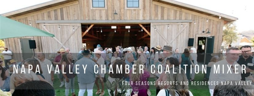 Large group of people in front barn with the words Napa County Chamber Coalition Four Seasons Resorts and Residences Napa Valley over it