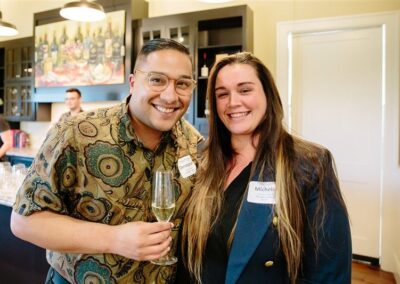 man in glasses and brown haired lady smiling for the camera