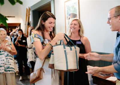 A lady winning a prize bag