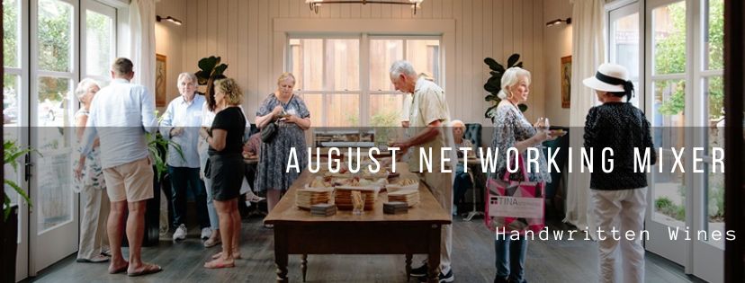 A large wood table with food on it and people milling around with the words August Networking Mixer Handwritten Wines over it.